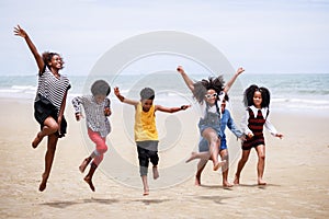 Funny vacation. Children or kids playing and romp together at the beach on holiday. Having fun after unlocking down the city from