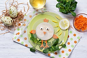 Funny vegetables, sandwich in a shape of chick, food for kids Easter idea, top view