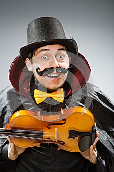 The funny violin player wearing tophat