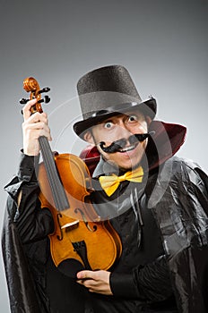The funny violin player wearing tophat
