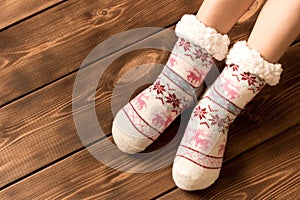 Funny warm socks on the little girl`s feet