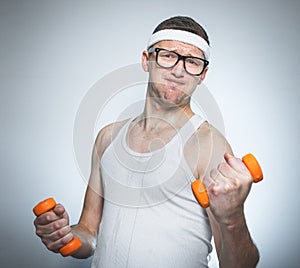 Funny weak man lifting biceps