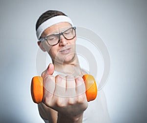 Funny weak man lifting biceps