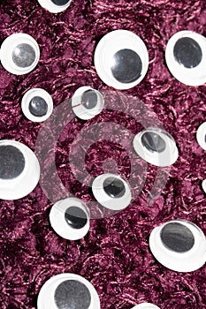 Funny Wiggle Google Eyes on Fabric Background photo