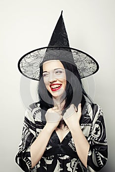 Funny Witch. Young happy woman with canival hat.