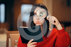 Funny Woman Checking Restaurant Bill with a Magnifying Glass