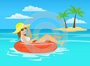 Funny woman with cocktail relaxing floating on inflatable inner ring in tropical ocean water