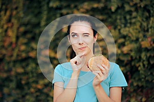 Funny Woman on a Diet Thinking about Eating a Burger