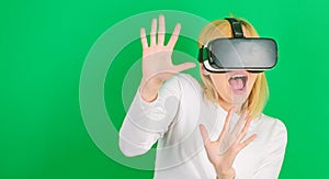 Funny woman experiencing 3D gadget technology - close up. Woman using virtual reality headset. Happy woman exploring