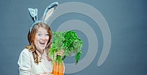 Funny woman with fresh carrot. Picture with space for your text