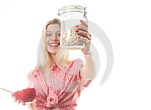 Funny woman with healthy granola nutritive oatmeal isolated on white studio background. Morning breakfast. Healthy food