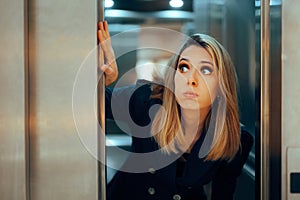 Funny Woman Holding the Elevator Door with her Hand