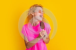 funny woman with icelolly ice cream isolated on yellow. woman with icelolly ice cream