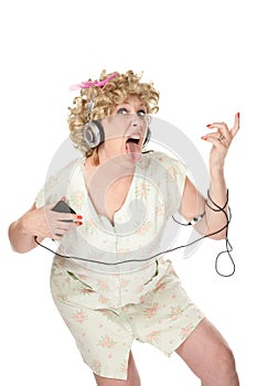 Funny woman in nightgown listening to music