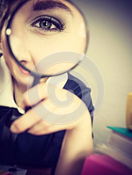 Funny woman office working secretary with magnifier