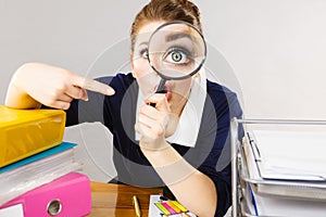 Funny woman office working secretary with magnifier