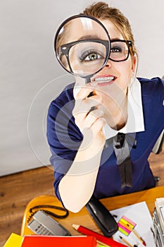 Funny woman office working secretary with magnifier