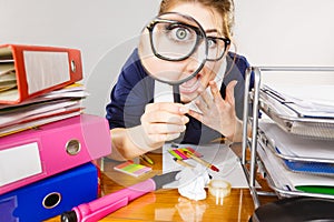 Funny woman office working secretary with magnifier