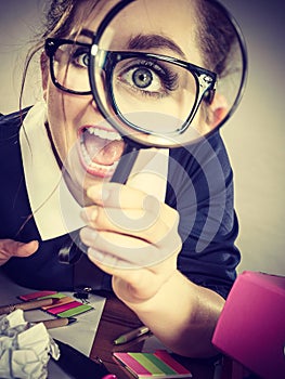 Funny woman office working secretary with magnifier