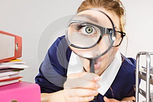 Funny woman office working secretary with magnifier