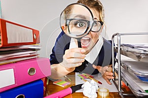 Funny woman office working secretary with magnifier