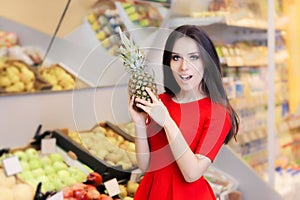 Funny Woman with Pineapple Fruit in Supermarket