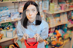 Funny Woman in Toy Store Holding a Tiny Shopping Basket