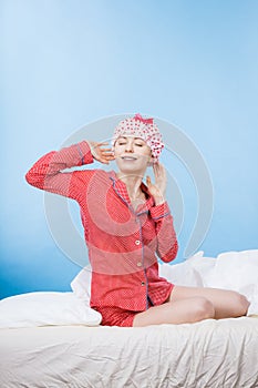 Funny woman wearing pajamas and bathing cap