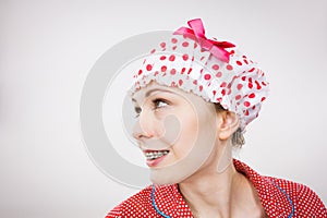 Funny woman wearing pajamas and bathing cap