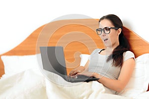 Funny Woman Working From Home On Her Laptop in Bed