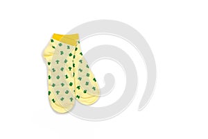 Funny womens or mens, unisex, cropped yellow socks with green cacti isolated on white background, copy space, flat lay. Fashion