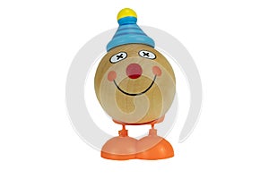Funny wooden toy clown isolated on white background.