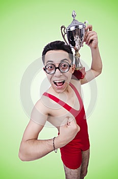 Funny wrestler with winners cup