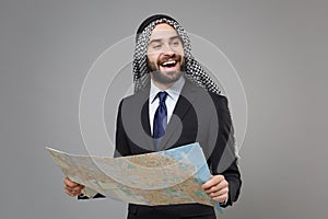 Funny young bearded arabian muslim businessman in keffiyeh kafiya ring igal agal classic black suit shirt tie isolated