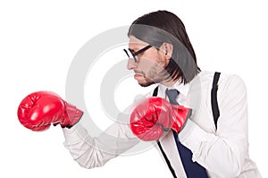 Funny young businessman with boxing gloves isolated