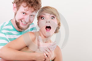 Funny young couple making silly face