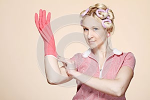 Funny young housewife with gloves