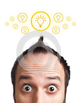 Funny young man with light bulb over his head