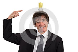 Funny young man with light bulb over his head, isolated on white background