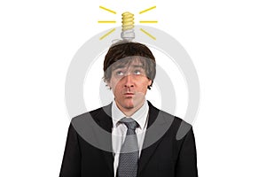 Funny young man with light bulb over his head, isolated on white background