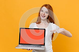 Funny young redhead woman girl in white t-shirt posing isolated on yellow background. People lifestyle concept. Mock up