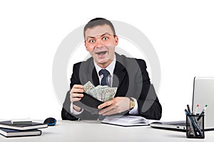 Funny young screaming successful caucasian businessman in black suit holding money