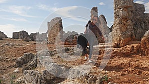 Funny young woman archeologist brings big luggage