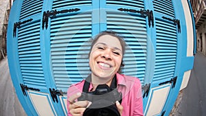 Funny Young woman photographer with camera. Fish eye