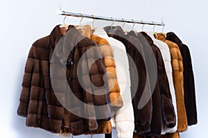 Fur coats on hangers in the interior