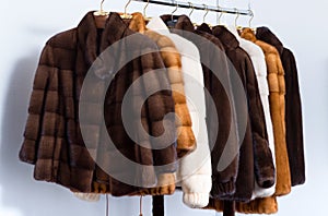 Fur coats on hangers in the interior