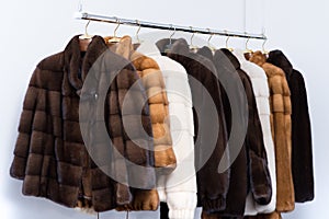 Fur coats on hangers in the interior.