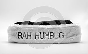 Fur hat with Bah Humbug on it in black and white photo