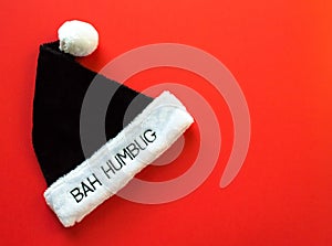 Fur hat saying Bah Humbug on a red background photo