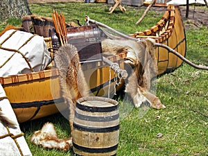 fur pelts with Indian canoe